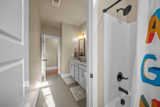 bathroom featuring vanity, tile patterned floors, and shower / bath combination with curtain