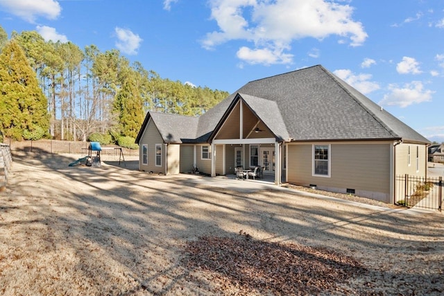 back of house with a patio