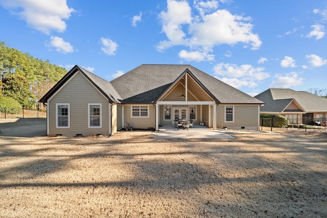 back of property with ceiling fan, a patio area, and french doors