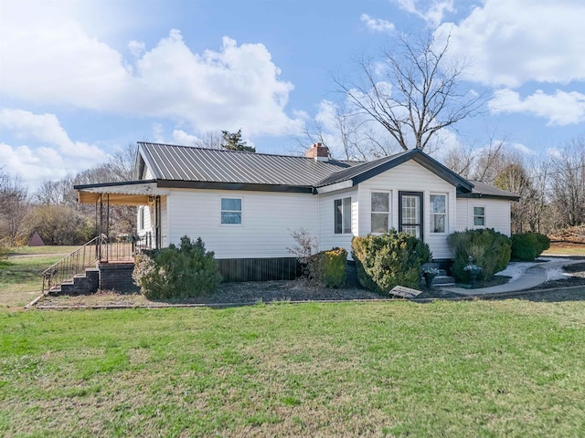 back of house with a yard