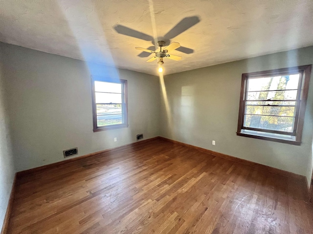 spare room featuring ceiling fan and wood-type flooring