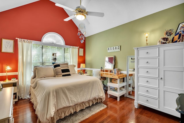 bedroom with ceiling fan, dark wood-type flooring, and high vaulted ceiling