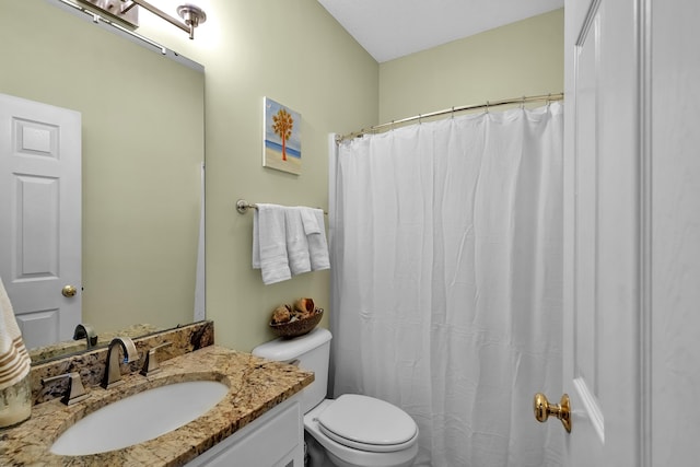 bathroom with toilet and vanity