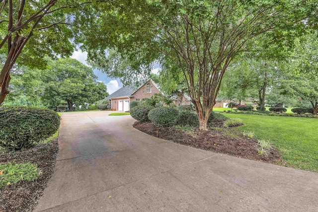 view of front of house with a front yard and a garage