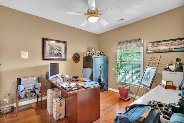 home office featuring ceiling fan and hardwood / wood-style floors