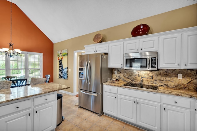 kitchen with white cabinetry, stainless steel appliances, backsplash, and decorative light fixtures