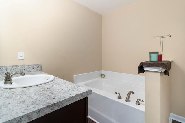 bathroom featuring a bathtub and vanity