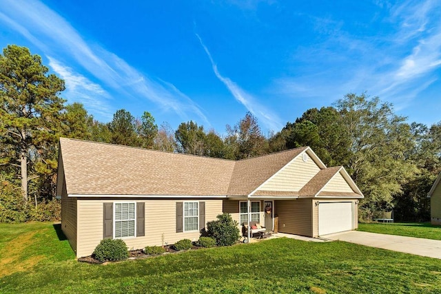 ranch-style house featuring a front yard and a garage