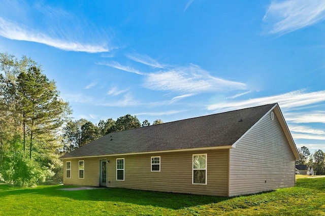 back of house with a yard