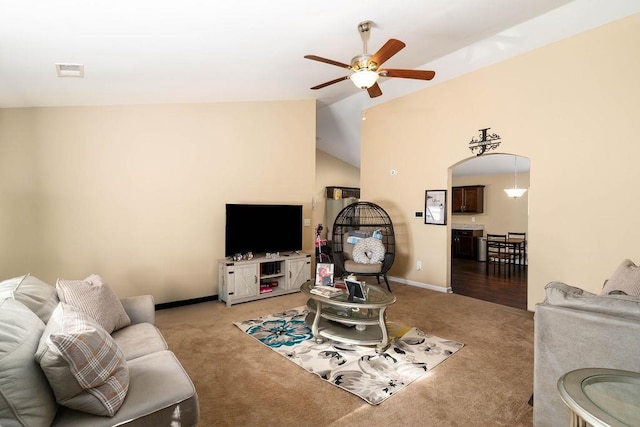 carpeted living room featuring ceiling fan and lofted ceiling