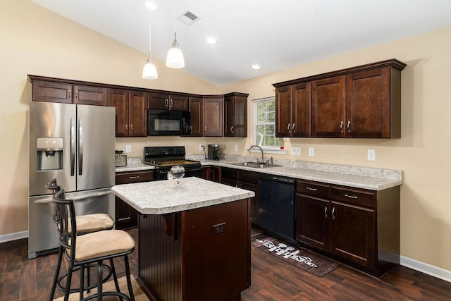 kitchen with dark hardwood / wood-style floors, pendant lighting, black appliances, a center island, and sink