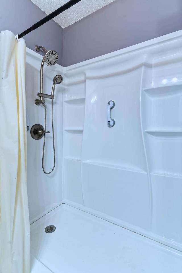 bathroom with a shower with shower curtain