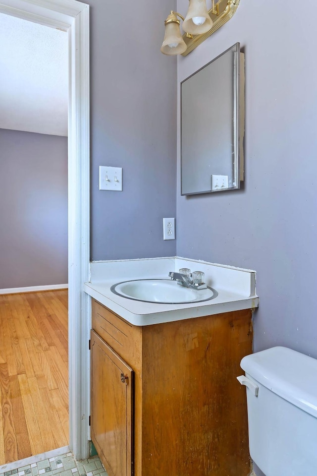 bathroom with toilet and vanity