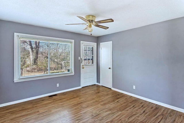 spare room featuring ceiling fan and wood-type flooring