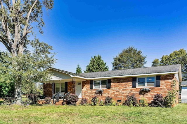 ranch-style home featuring a front yard and a porch