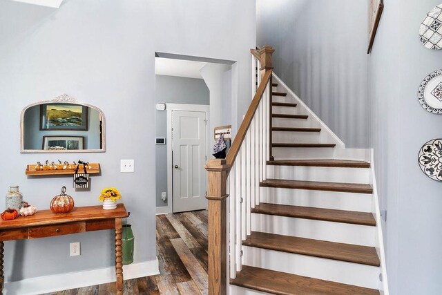 stairway featuring hardwood / wood-style flooring