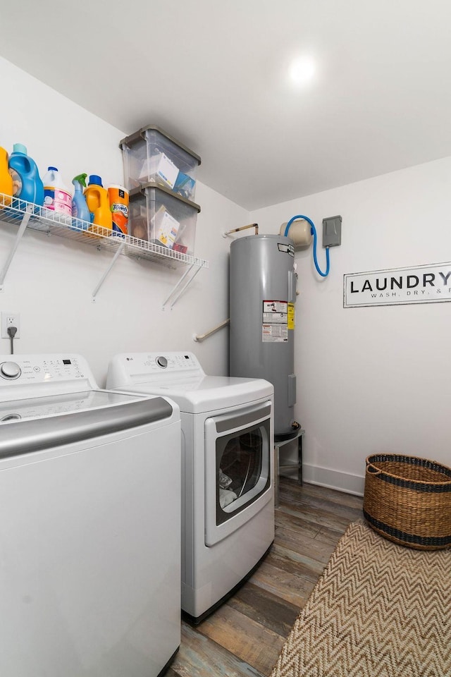 laundry room with water heater, dark hardwood / wood-style floors, and washing machine and clothes dryer