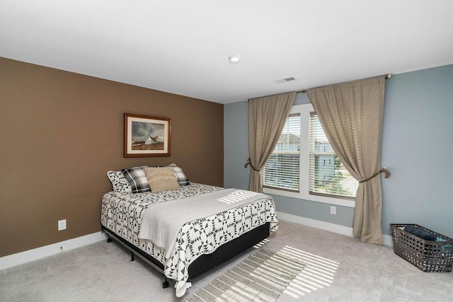 bedroom with light colored carpet