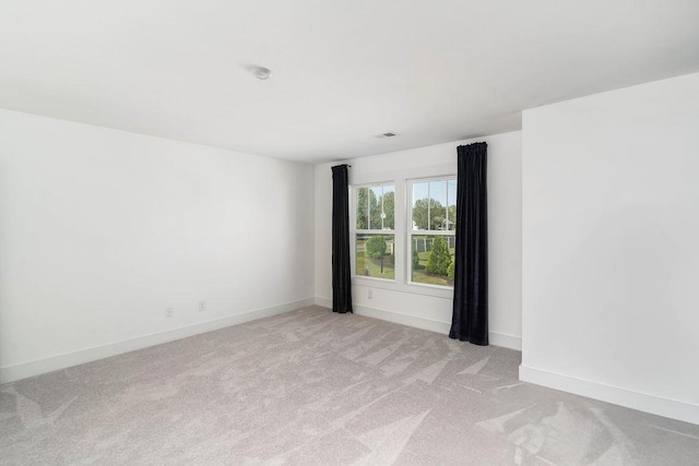 empty room featuring light colored carpet