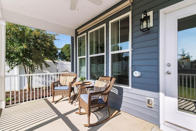 exterior space with ceiling fan and a porch