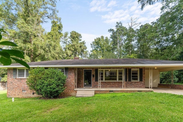 view of front facade with a front lawn and a carport