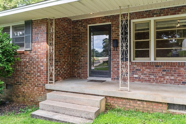 entrance to property with covered porch