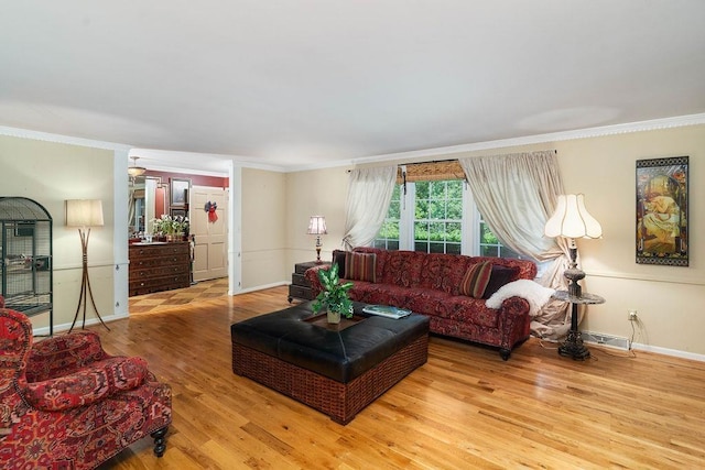 living room featuring wood-type flooring and crown molding