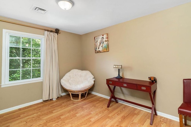 sitting room with light hardwood / wood-style flooring