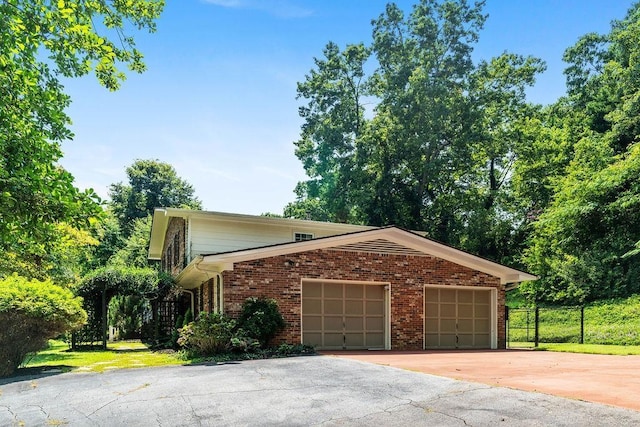 view of side of property with a garage