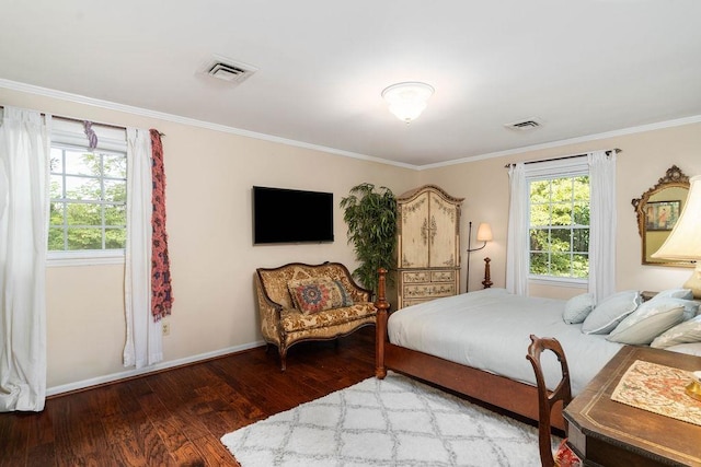 bedroom with crown molding and hardwood / wood-style floors