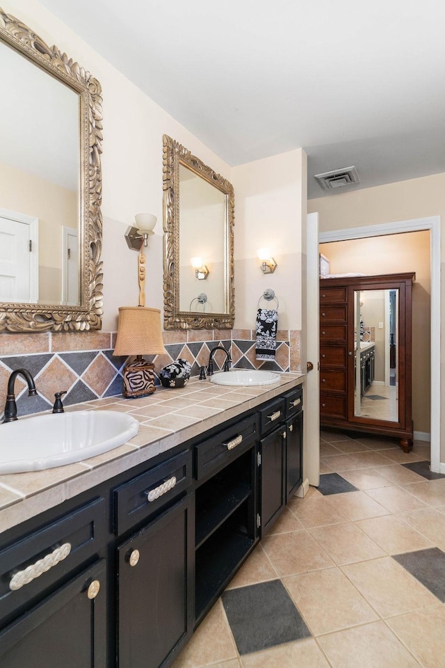 bathroom with vanity and tile patterned flooring