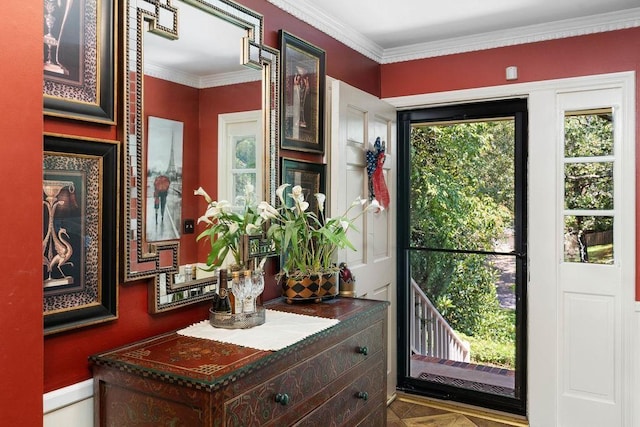 doorway to outside featuring ornamental molding and parquet floors