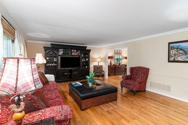 living room with hardwood / wood-style floors and ornamental molding