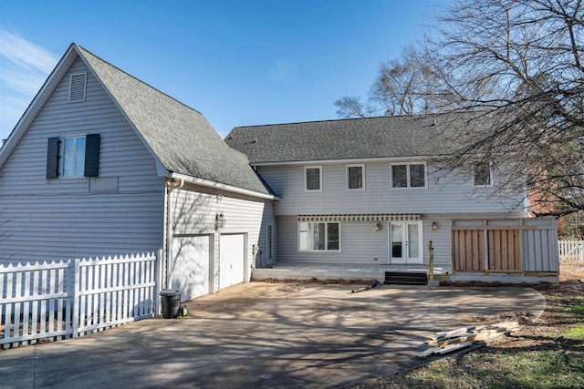 back of house with a garage