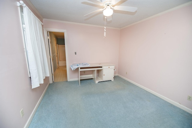 unfurnished office featuring crown molding, ceiling fan, light carpet, and a textured ceiling