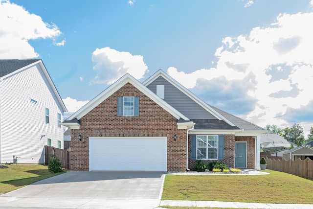 view of front of home with a front lawn and a garage