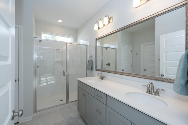 bathroom with walk in shower and vanity