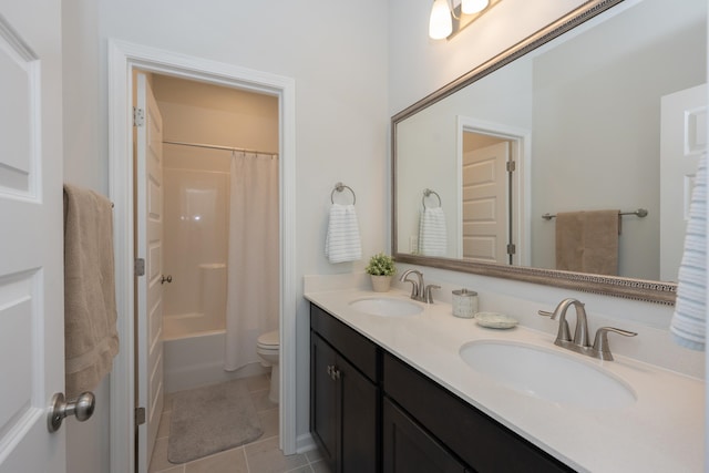 full bathroom featuring toilet, vanity, tile patterned floors, and shower / bath combo with shower curtain