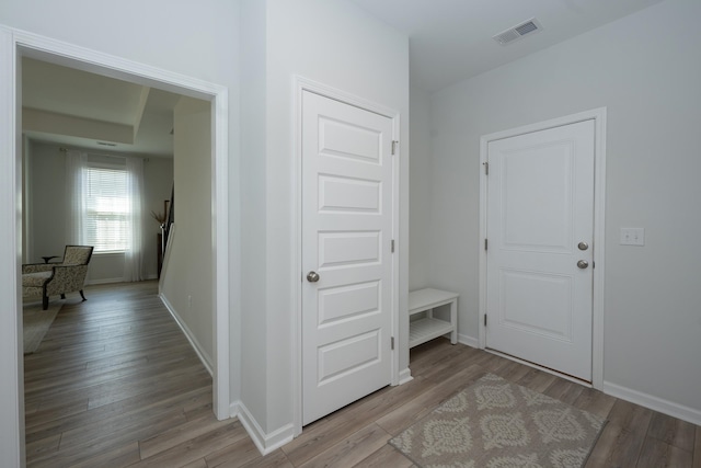 corridor featuring light hardwood / wood-style floors