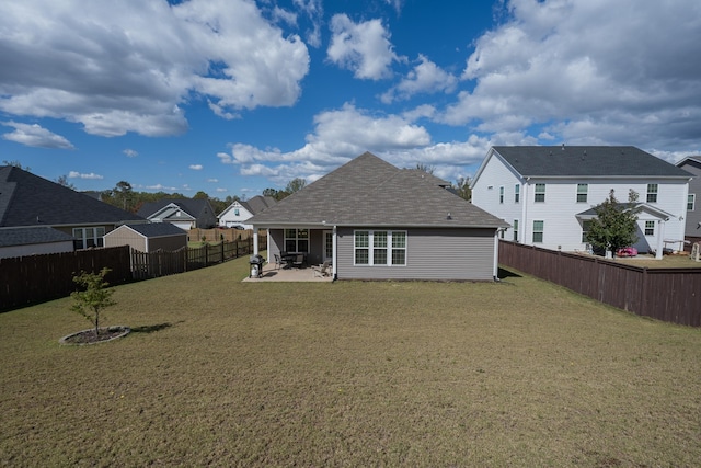 back of property featuring a patio area and a lawn