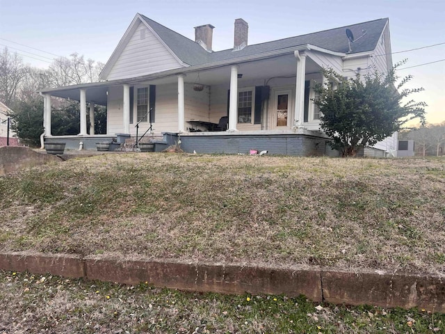 back of house with a porch