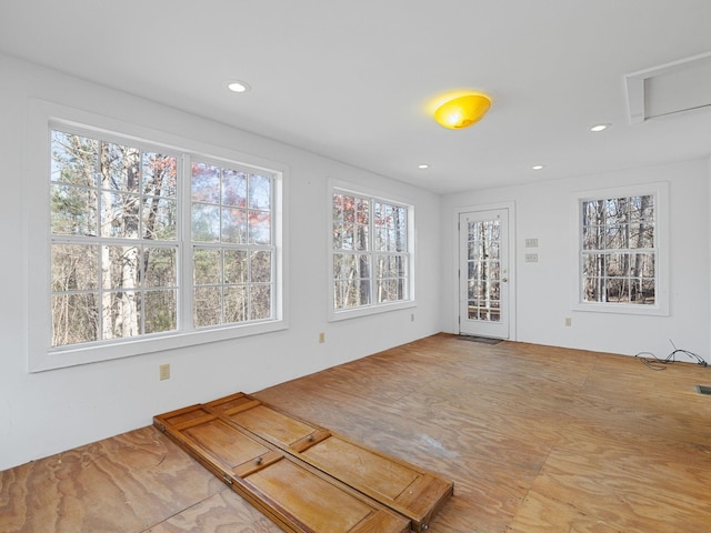 unfurnished living room featuring a healthy amount of sunlight