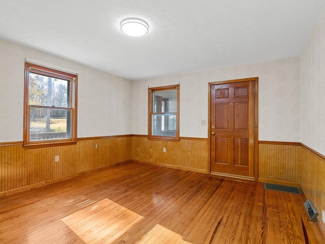 spare room with wood-type flooring