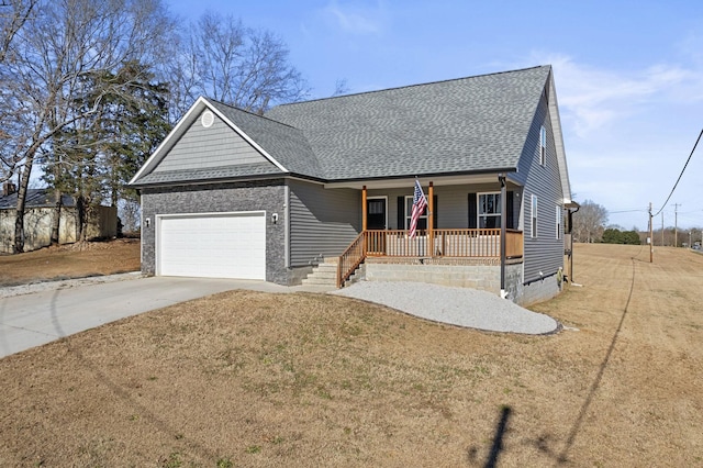 single story home with a front yard, a garage, and a porch