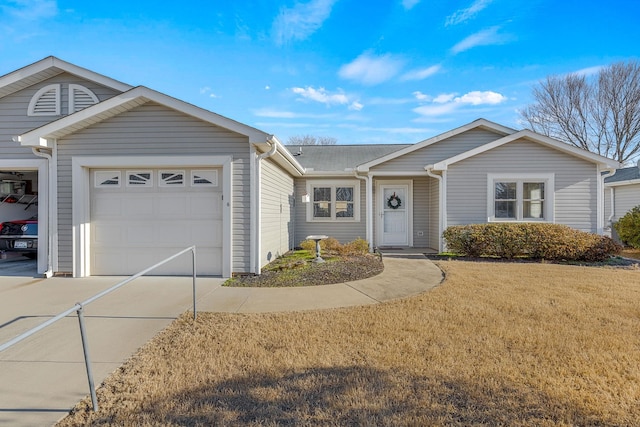 single story home featuring a garage and a front yard