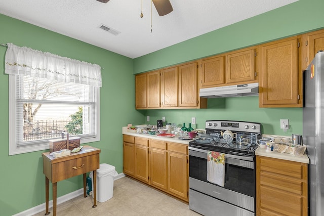 kitchen with ceiling fan and stainless steel appliances