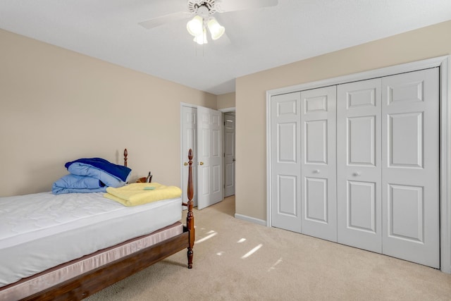 carpeted bedroom featuring ceiling fan