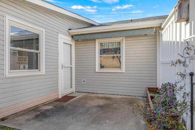 doorway to property with a patio