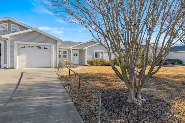 ranch-style home with a front yard and a garage