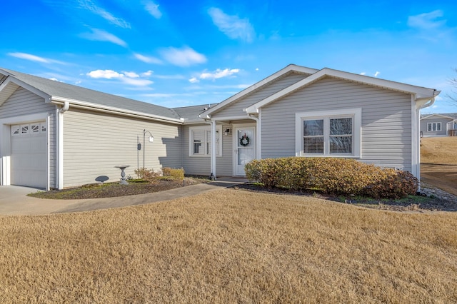 ranch-style home with a front lawn and a garage